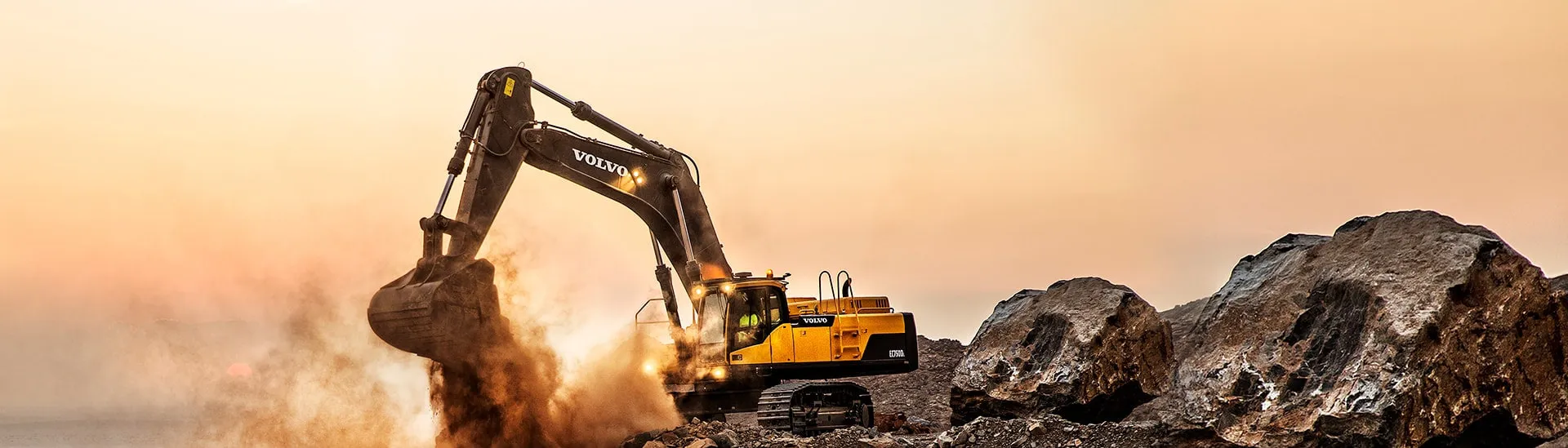Excavator loading rock at a mining site